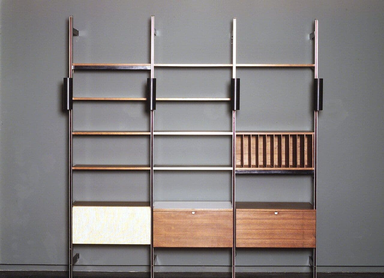 Mid-century wall storage system with poles, open shelves and walnut cabinets