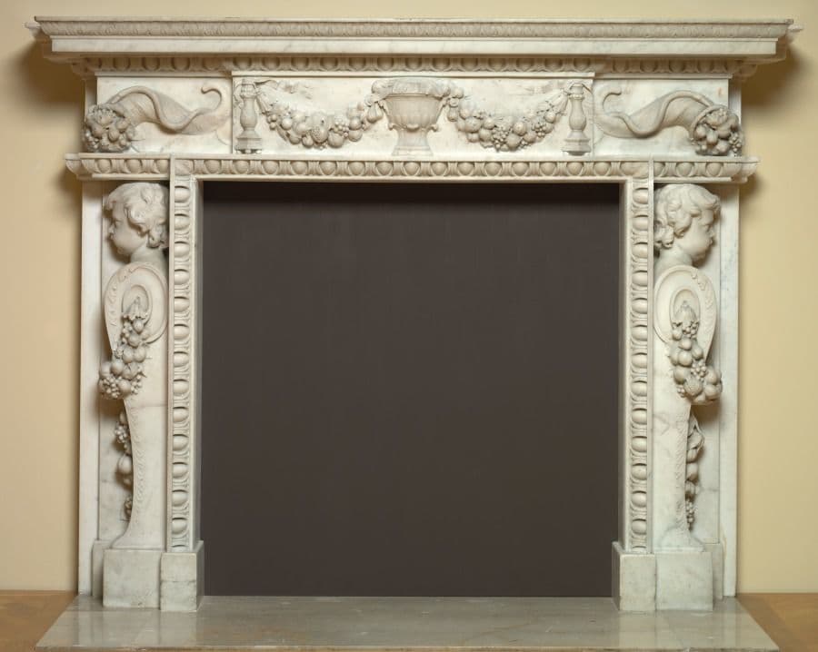 White marble Palladian mantel with scroll brackets, cornucopias and a central bust
