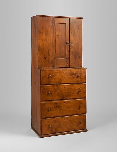 Plain Shaker cupboard with flat recessed-panel doors and small wooden knobs