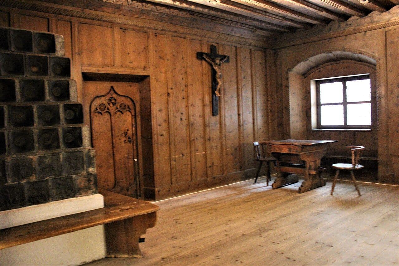 Historic Tyrolean wood-paneled room with board walls and built-in benches