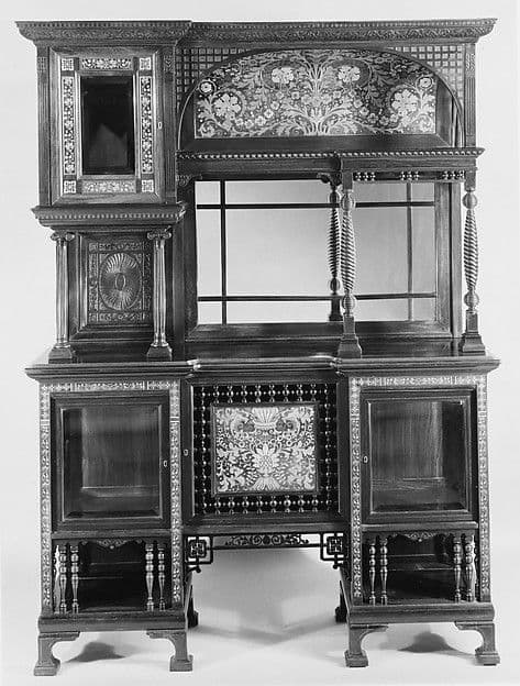 Ornate dark Victorian cabinet with mirrored upper section, spindle galleries and inlaid panels