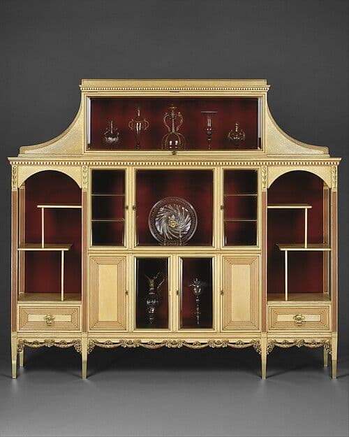 Cream and gold Victorian display cabinet with glass doors, open shelves and a stepped upper section