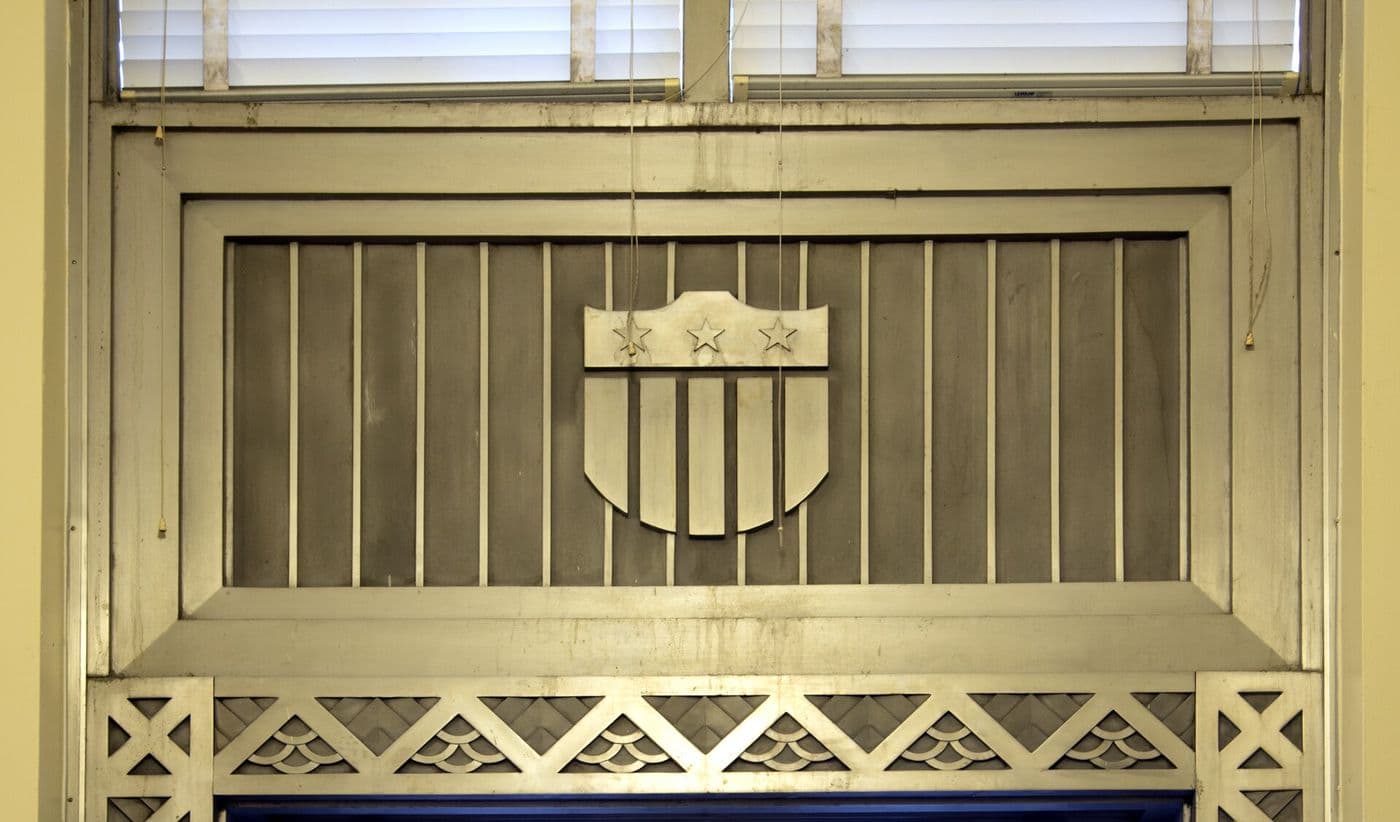 Art Deco interior doorway with a decorative stepped panel above the door