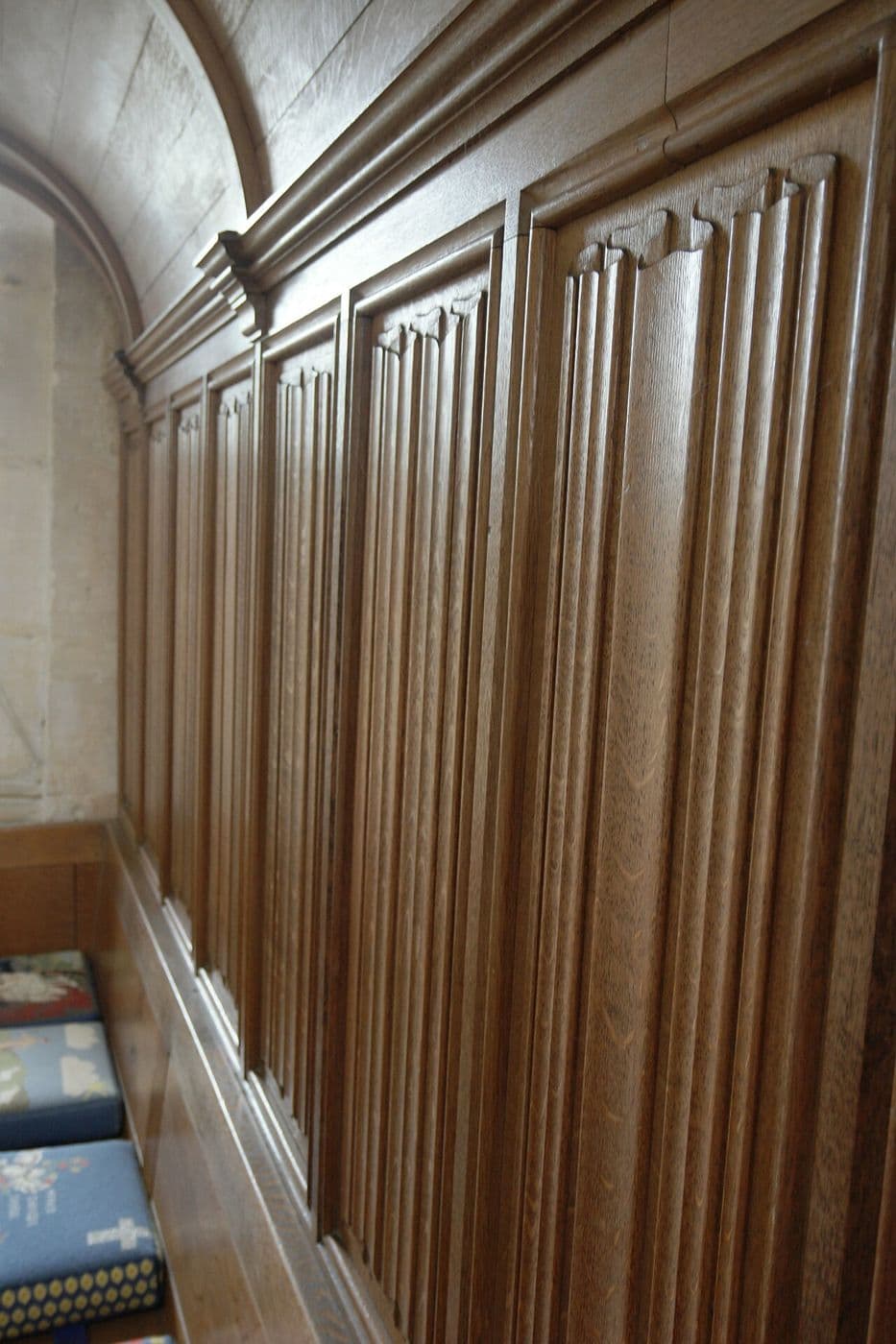 Carved oak linenfold panel set in a moulded frame in an English church