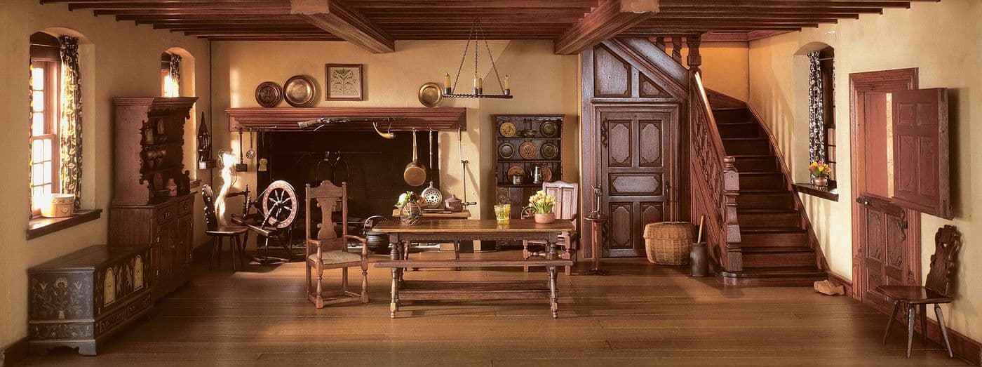 Miniature colonial kitchen with a large hearth, open dresser with pewter and plank walls